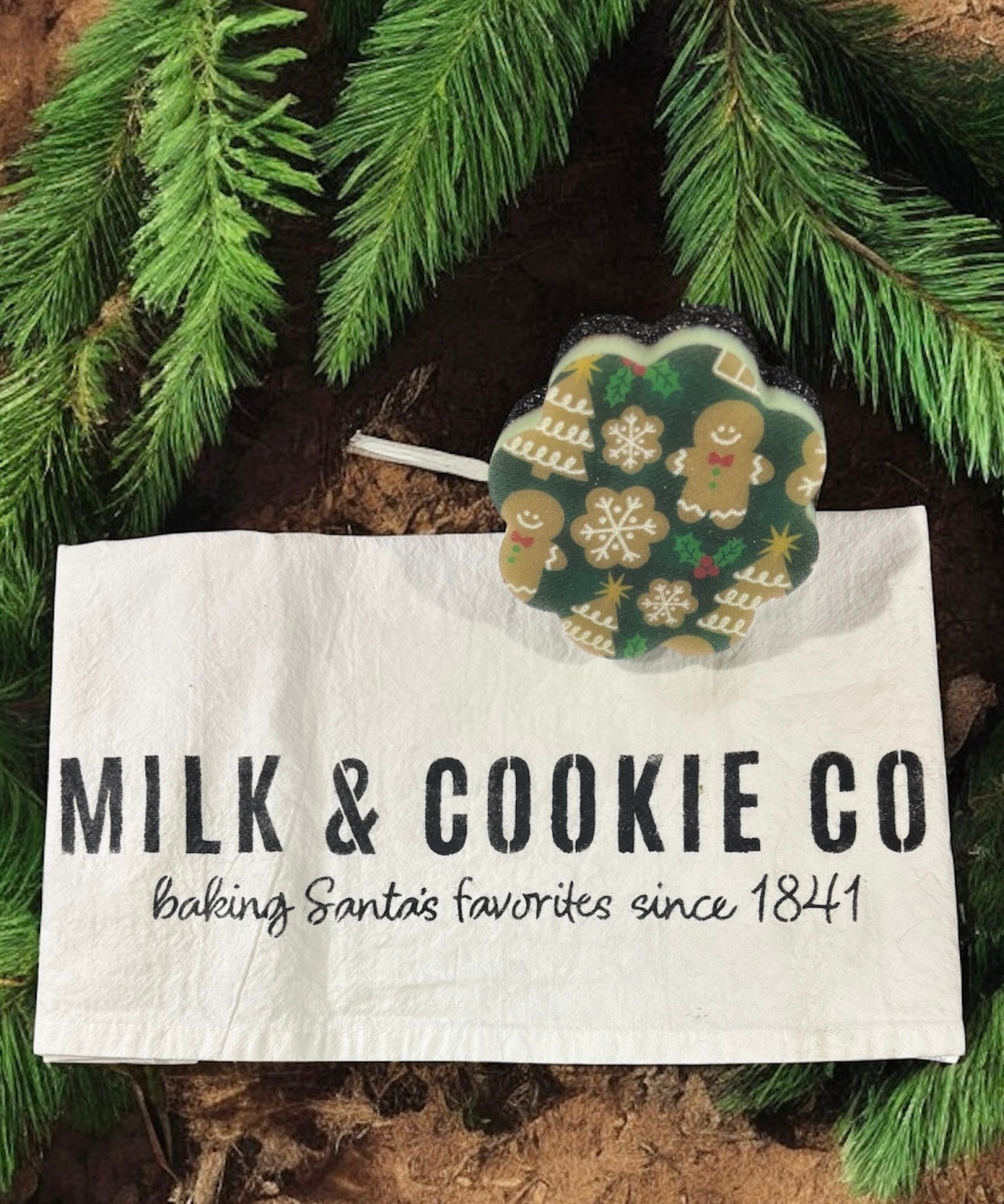 Milk & Cookie Co bag with a cookie-shaped decoration on a natural background