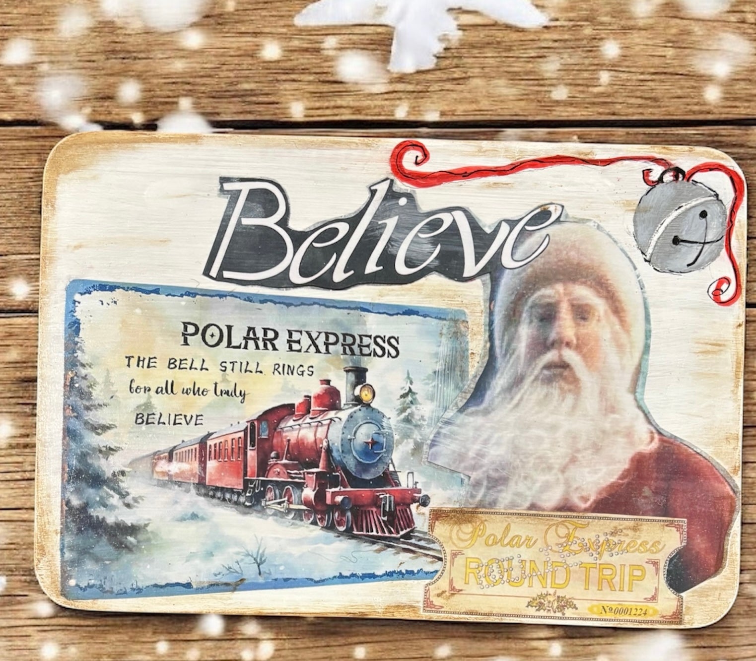 Vintage-style Polar Express poster with Santa Claus and a train, featuring the word 'Believe'.